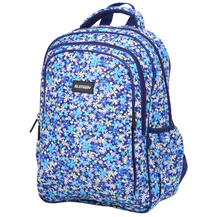 A midsize kids' backpack with a navy blue base and a floral pattern in shades of blue and white. It features multiple compartments and has a dark blue padded carry handle.