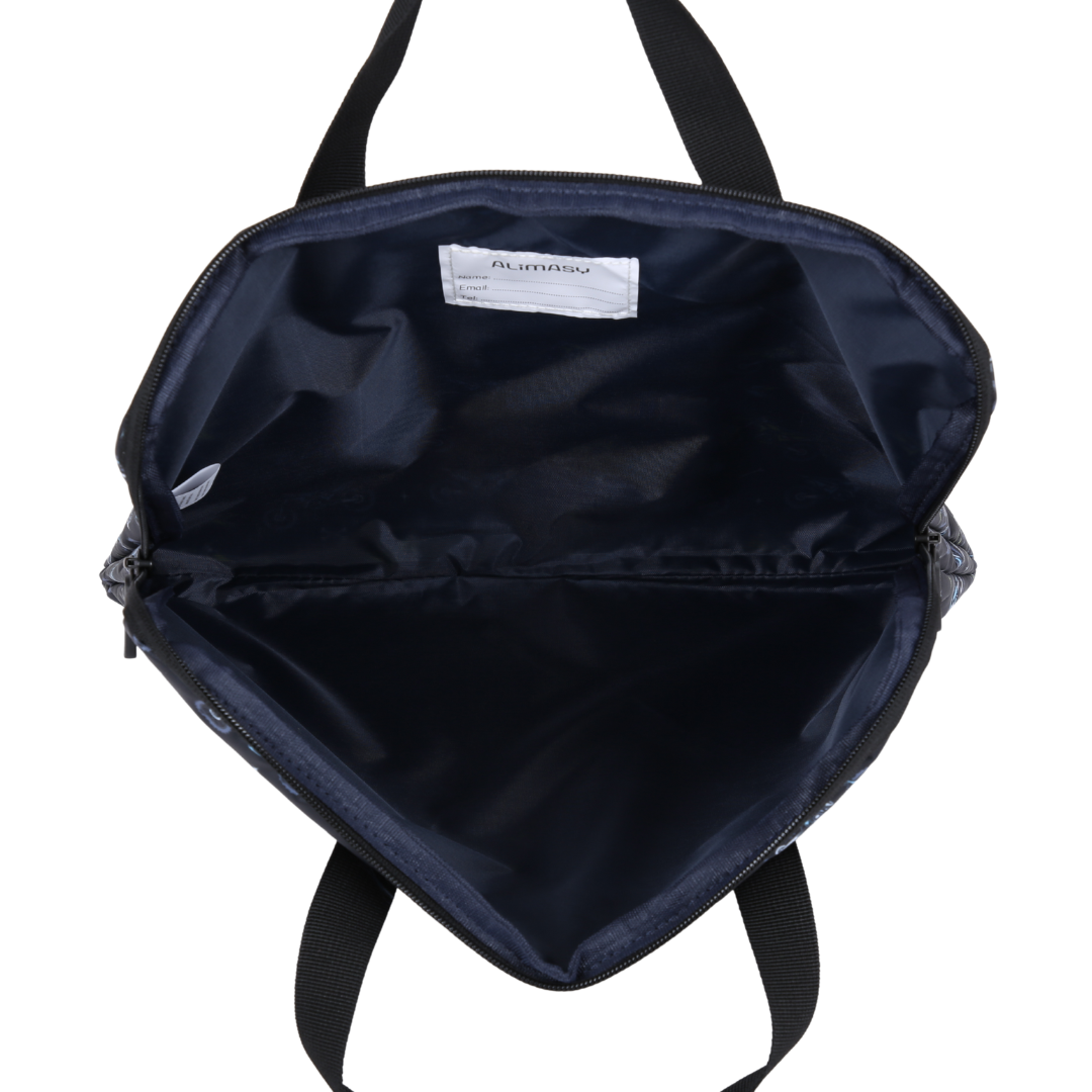 Inside Black library bag with name label on a white background